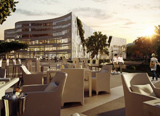 Kö-Bogen Düsseldorf, geschwungene Fassade im Abendlicht